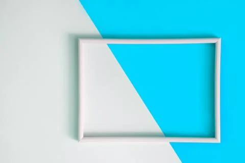 Empty photo frame for text on geometric paper background. Stock Photos