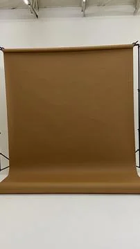 Empty Photo Studio Setup with Brown Paper Roll Backdrop Stand Stock Photos