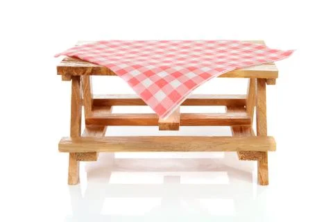 Empty picnic table with tablecloth Stock Photos
