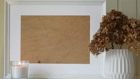 Empty picture frame with beautiful bouquet of dried hydrangea flowers. Stock Footage 196181173