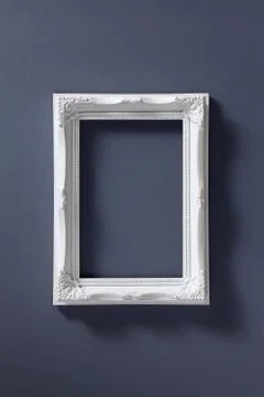 Empty picture frame on dark background Stock Photos