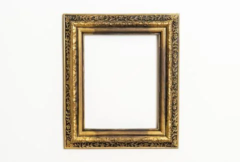 Empty picture frame on white wall background Stock Photos