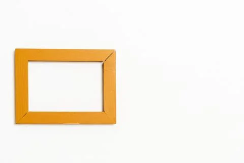 Empty picture frame on white wall background Stock Photos
