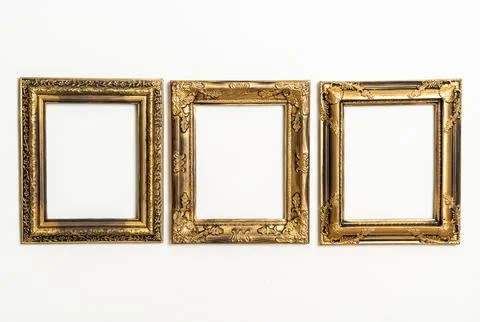 Empty picture frame on white wall background Stock Photos