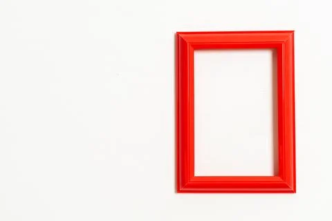 Empty picture frame on white wall background Stock Photos