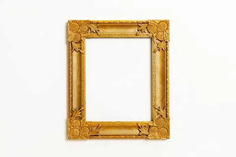 Empty picture frame on white wall background Stock Photos