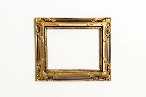 Empty picture frame on white wall background Stock Photos