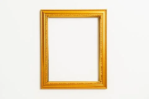 Empty picture frame on white wall background Stock Photos