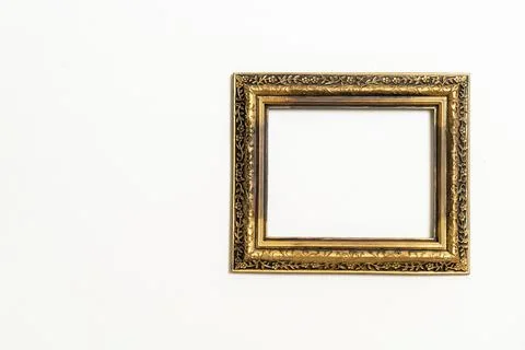 Empty picture frame on white wall background Stock Photos