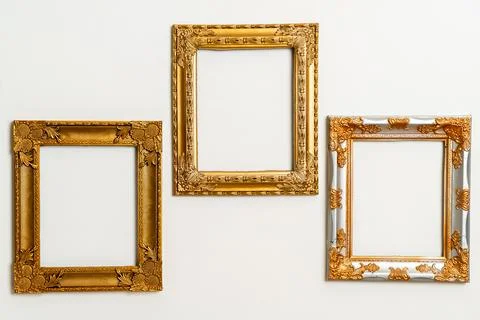 Empty picture frame on white wall background Stock Photos