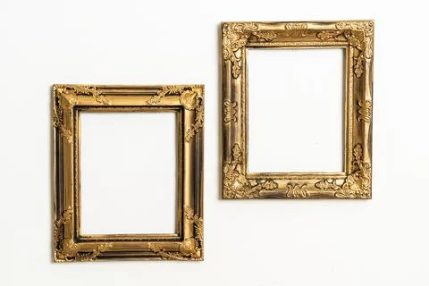 Empty picture frame on white wall background Stock Photos