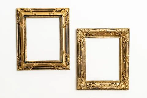 Empty picture frame on white wall background Stock Photos