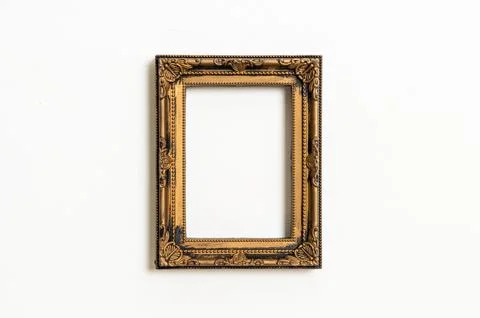Empty picture frame on white wall background Stock Photos