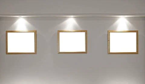 Empty picture frames on the wall with lighting Stock Photos