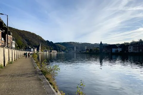 Empty pier alongside the Meuse river in Dinant, Belgium Stock Photos