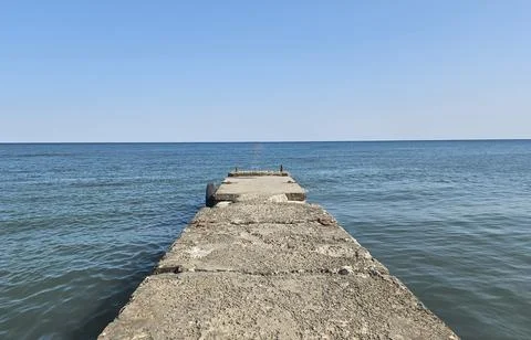 Empty pier with sea and sky as background. Cloudy sky serene ocean. Brighton Stock Photos