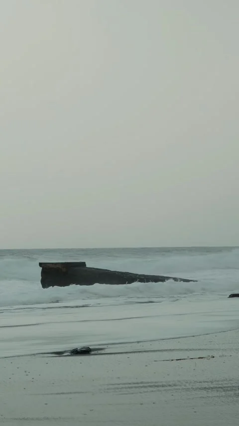 Empty pier at stormy dramatic sea with huge waves at windy day. Vertical video Stock Footage 316314013