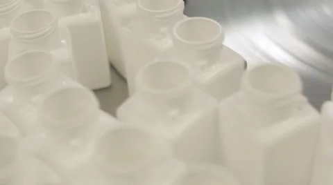 Empty Pill Bottles being Queued for Filling Stock Footage 68642308