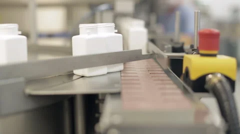 Empty Pill Bottles being Queued for Filling Stock Footage 68642317