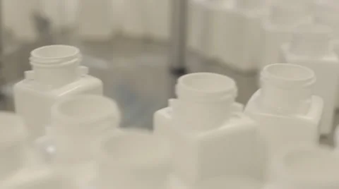 Empty Pill Bottles being Queued for Filling Stock Footage 68642367