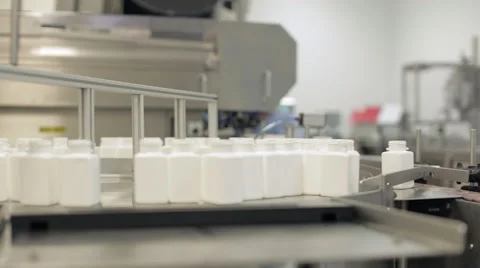 Empty Pill Bottles being Queued for Filling Stock Footage 68642404