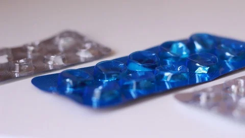 Empty pill packs on white surface Stock Footage 88764378