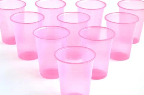 Empty pink plastic glasses Stock Photos