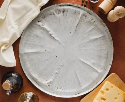 Empty pizza backing sheet. Flatlay Stock Photos