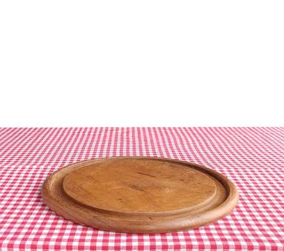 Empty pizza board on table with red checkered tablecloth. clipping path Stock Photos