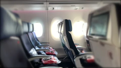 Empty plane seats during pandemic, passenger travelling on airplane Stock Footage 154972824