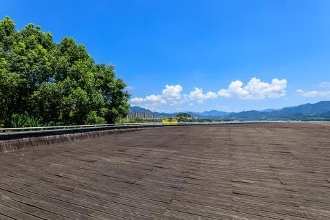 Empty plank square and green tree with mountain natural scenery in Hangzhou Stock Photos