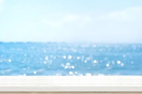 Empty plank white wood table top with blur blue sky and sea boekh background, Stock Photos