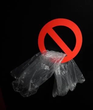 Empty plastic bag in a stop sign on black background. Concept of plastic Stock Photos