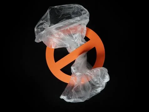 Empty plastic bag in a stop sign on black background. Concept of plastic Stock Photos