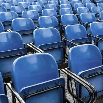 Empty plastic blue chairs Stock Photos