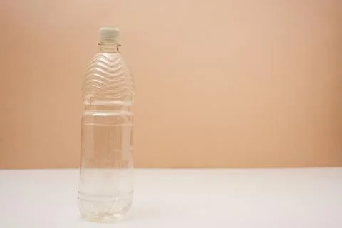 Empty plastic bottle with screw cap on pink background Stock Photos