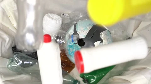Empty plastic bottles are thrown into the trash in slow motion Stock Footage 130175457