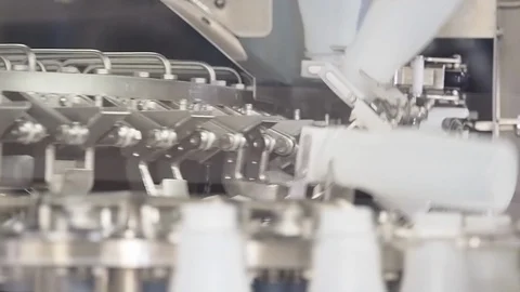 Empty plastic bottles. Being moved by machinery in plant Stock Footage 101975930