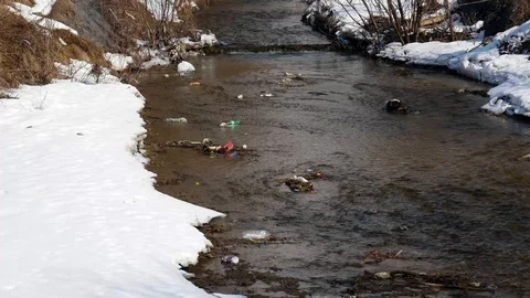 Empty plastic bottles in the clean small creek Stock Footage 104023713