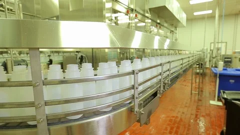 Empty plastic bottles. On conveyor belt in plant. pan Stock Footage 101976005