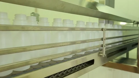 Empty plastic bottles. On conveyor belt in plant A Stock Footage 102185375