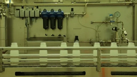 Empty plastic bottles. On conveyor belt in plant. rack focus Video stock 102185541