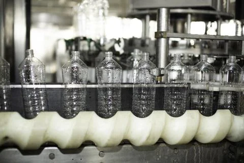 Empty plastic bottles on a conveyor 写真素材