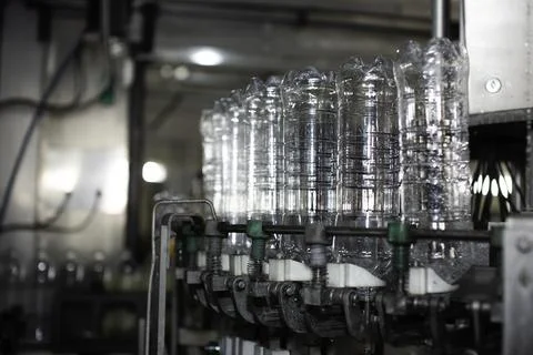 Empty plastic bottles on a conveyor Stock Photos