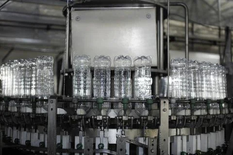 Empty plastic bottles on a conveyor Stock Photos