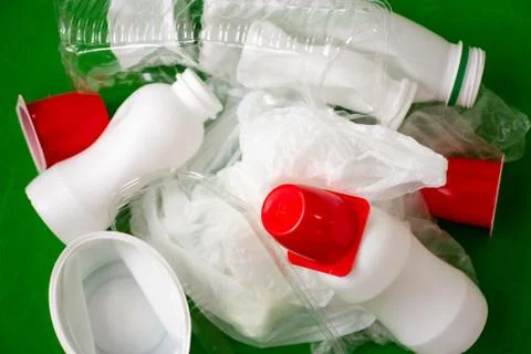 Empty plastic bottles, cups and bags for recycling. Stock Photos