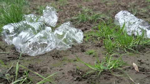 Empty plastic bottles laying the ground floor as trash and should be recycled. Video stock 332678960