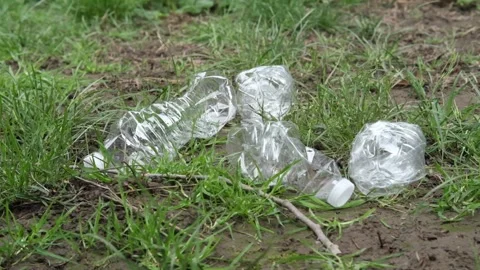 Empty plastic bottles laying the ground floor as trash and should be recycled. Video stock 332678964