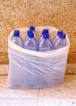 Empty plastic bottles in plastic bag Stock Photos