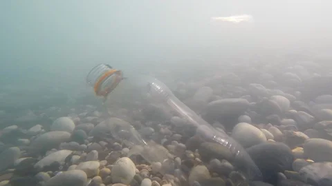 Empty plastic bottles sink to the bottom of the sea, carry a danger to the Stock Footage 93956968